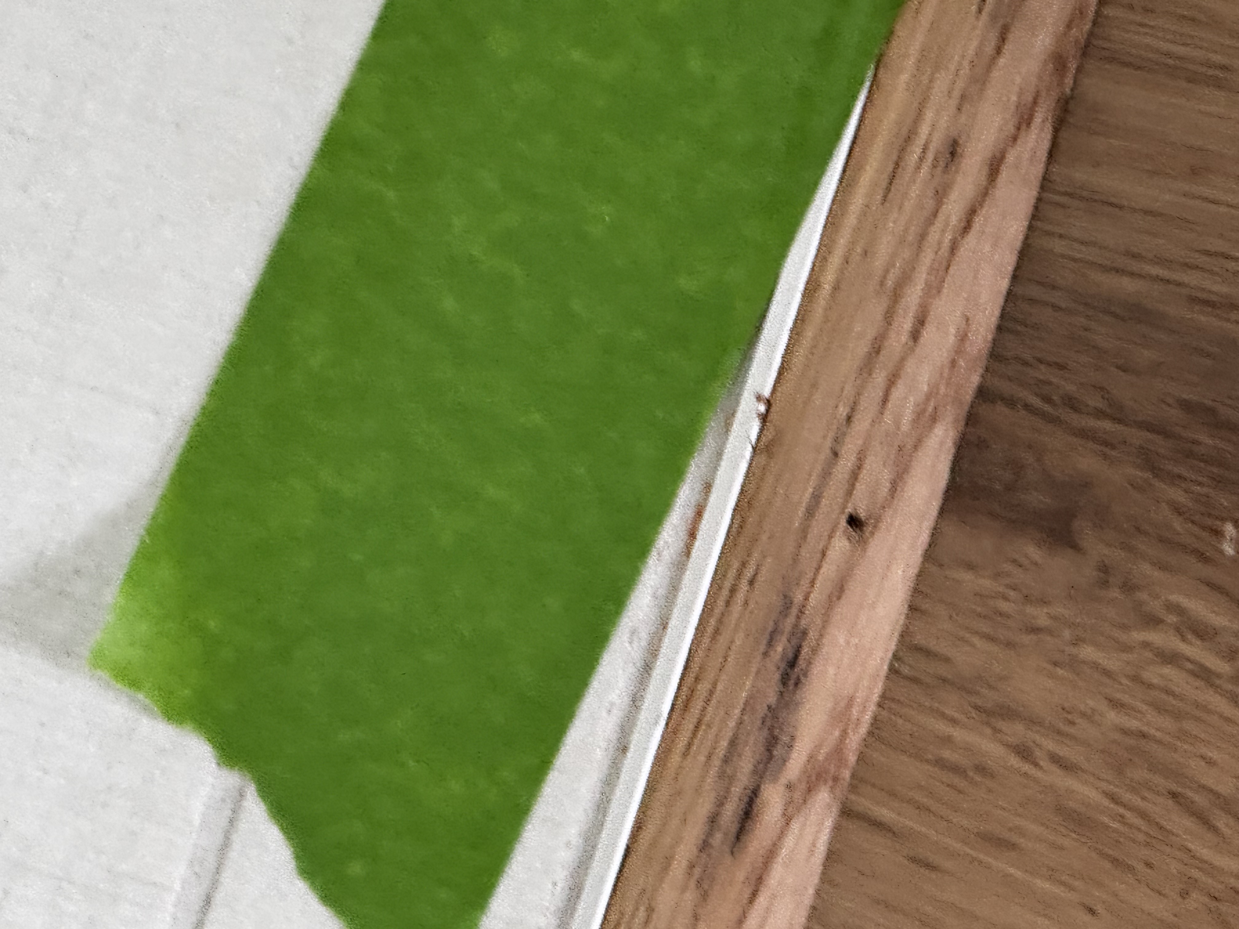 Piece of quarter round with visible nail holes
